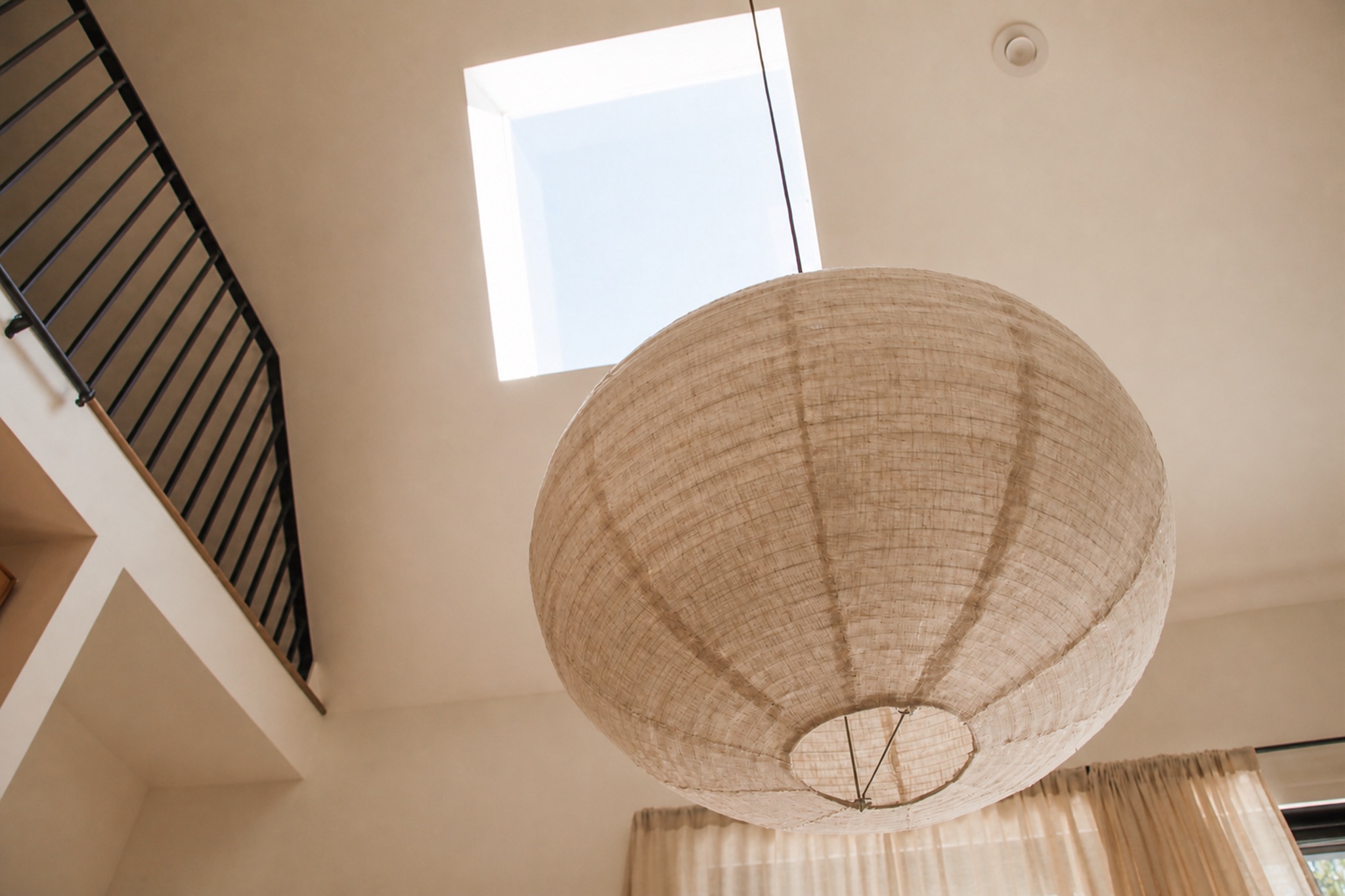 Large linen pendant light beneath the Norma cabin skylight